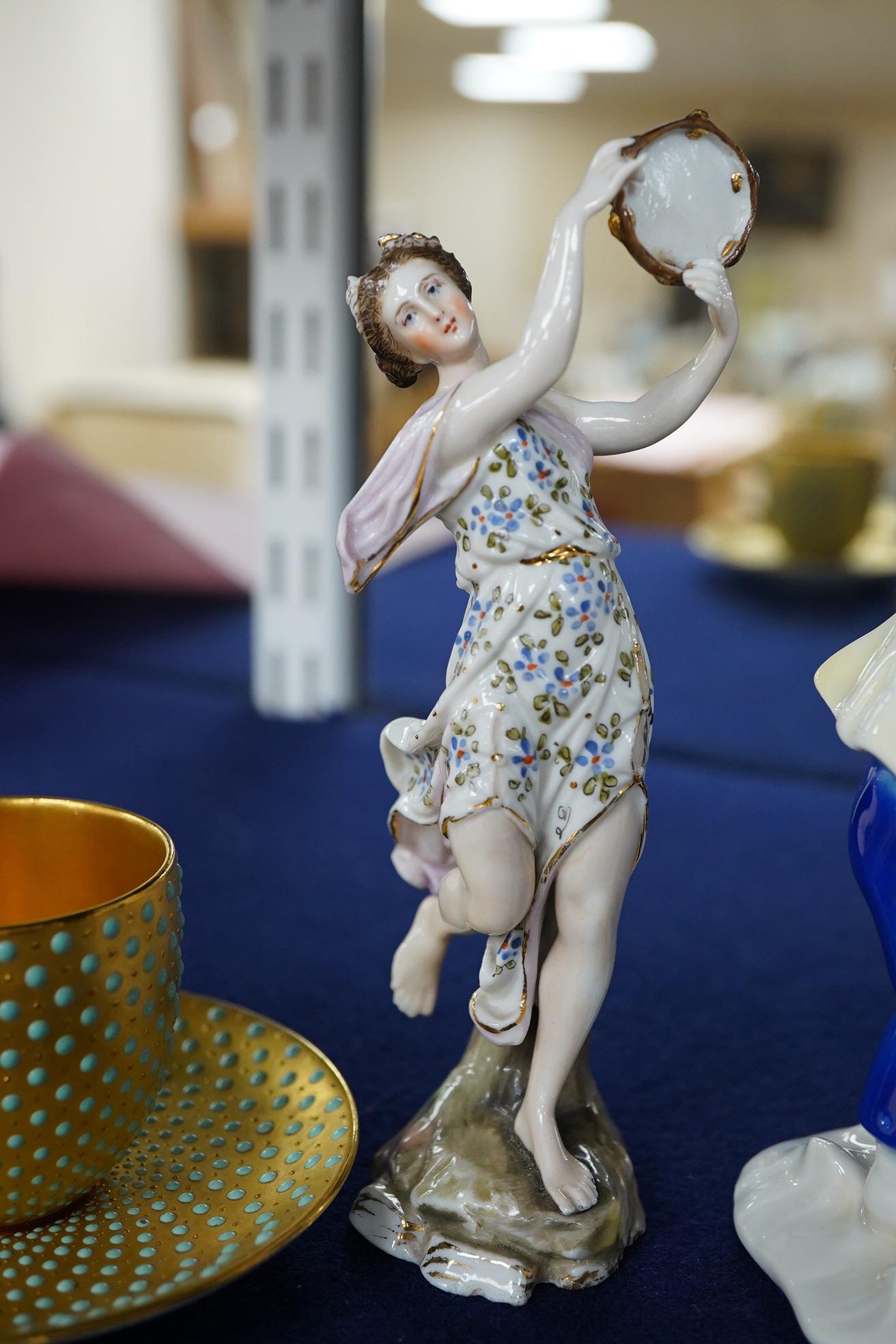 An early 20th century Coalport jewelled cabinet cup and saucer, a Karl Ens grop and a Plane figure